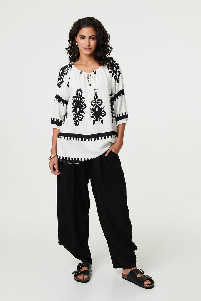 Ikat Print Tassel Tie Neck Blouse